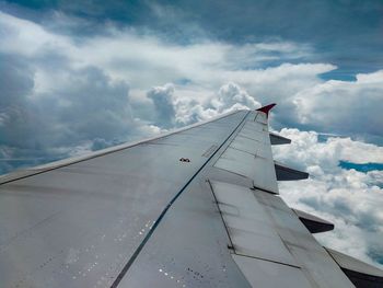 Low angle view of airplane flying in sky