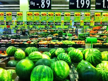 VARIETY OF FRUITS FOR SALE AT MARKET STALL