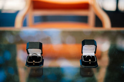 High angle view of wedding rings in box on table