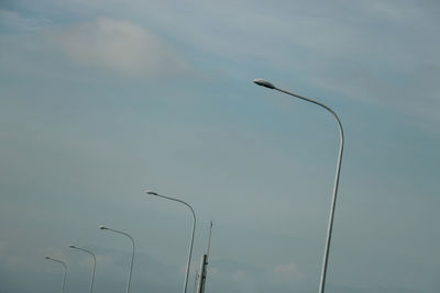 Low angle view of street light against sky