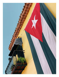 Low angle view of flag against building