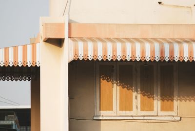 Low angle view of hanging outside building