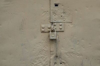 Close-up of door knocker on wall