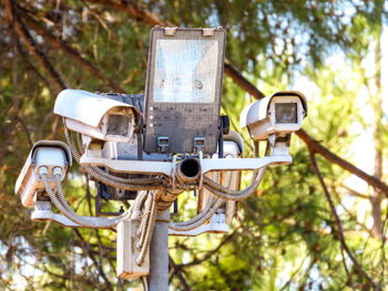 Low angle view of telephone booth in park