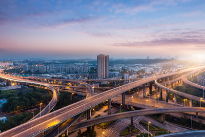 High angle view of light trails on highway in city