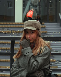 Portrait of beautiful young woman in hat