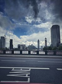 City street and buildings against sky