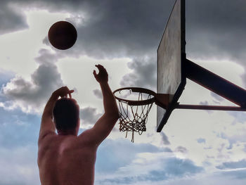 Low angle view of basketball hoop against sky