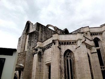 Low angle view of old building against sky