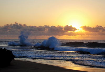 Scenic view of sea against sky during sunset