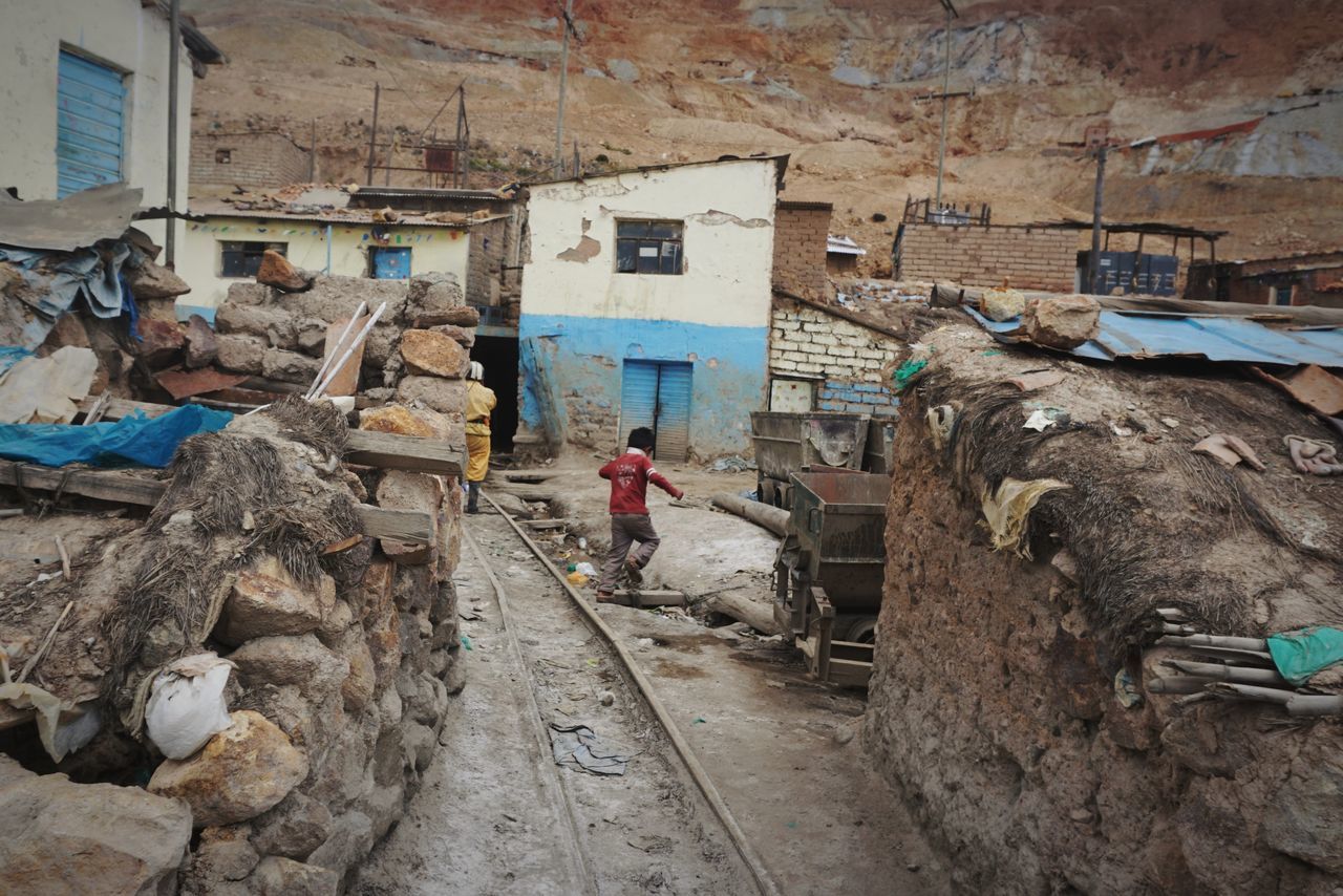 architecture, built structure, building exterior, real people, one person, working, men, occupation, day, full length, building, industry, construction industry, construction site, standing, outdoors, solid, residential district