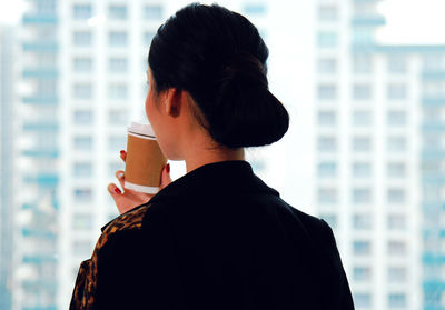 Rear view of man photographing