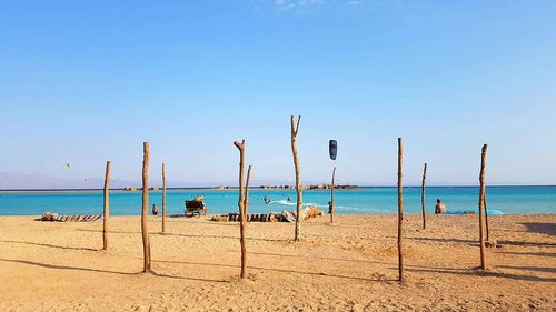 Scenic view of beach against clear sky