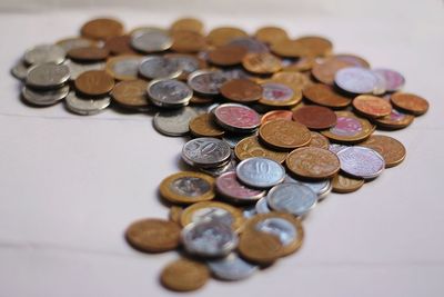 High angle view of coins on table