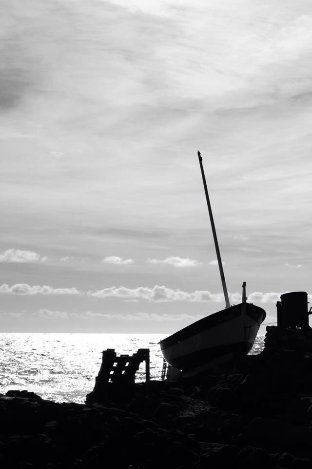 sea, sky, water, horizon over water, cloud - sky, nautical vessel, beach, cloudy, tranquility, nature, silhouette, cloud, scenics, tranquil scene, boat, beauty in nature, shore, transportation, outdoors, mode of transport