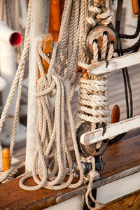 Close-up of ropes tied at ship