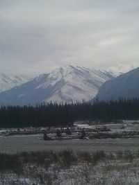 Scenic view of snow covered mountains