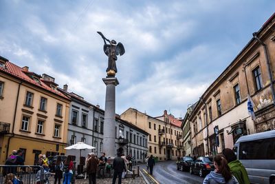 Low angle view of statue against cloudy sky