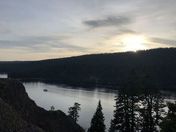Scenic view of lake against sky during sunset