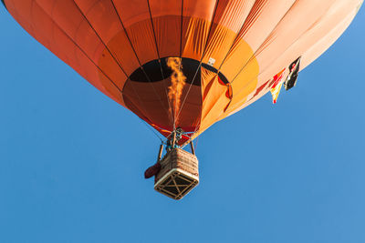 Low angle view of hot air balloon against clear sky