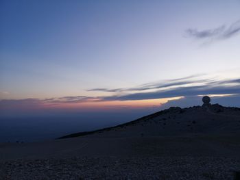 Scenic view of silhouette land against sky during sunset