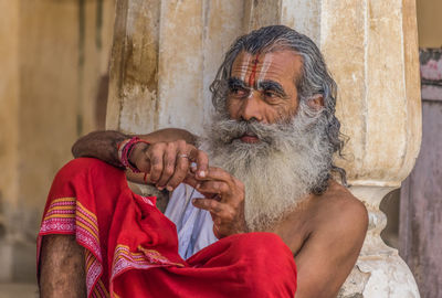 Portrait of man holding camera