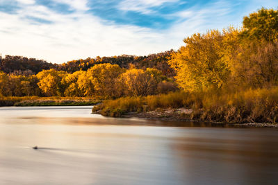 Scenic view of lake against sky during autumn