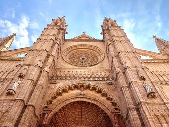 Low angle view of palma cathedral against sky