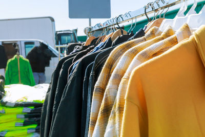 Clothes hanging on rack for sale at market