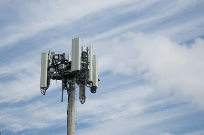 Low angle view of telephone pole against sky