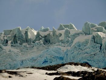 Scenic view of glacier against sky