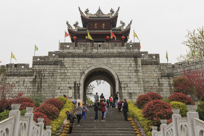 People in front of historic building