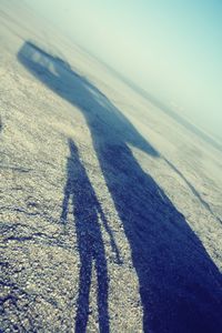 Shadow of people on beach