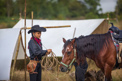 Rear view of woman riding horse