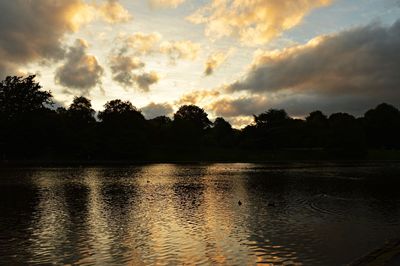 Scenic view of lake against sky during sunset