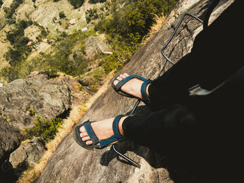 Low section of man standing on rock formation