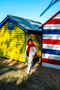 Portrait of man standing against built structure