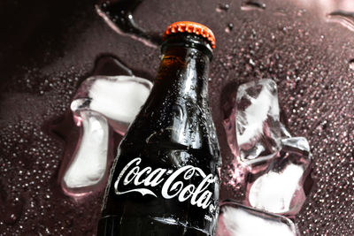 Close-up of beer in glass bottle