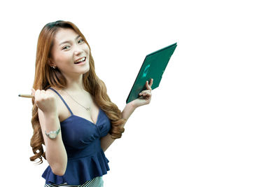 Young woman smiling against white background