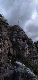 Low angle view of rock formation against sky