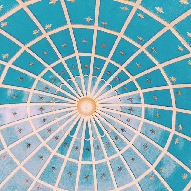 pattern, full frame, circle, backgrounds, geometric shape, blue, design, ceiling, built structure, metal, no people, shape, indoors, textured, high angle view, architecture, day, directly below, metallic