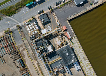 High angle view of buildings by river in city