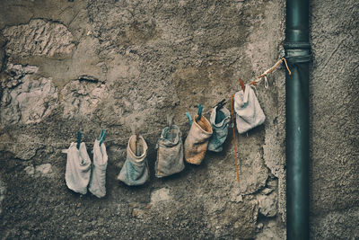 Clothes drying on clothesline against wall