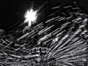 Close-up of illuminated carousel at night