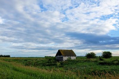 House on field against sky