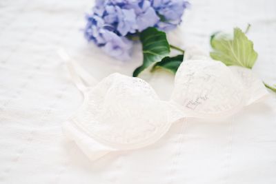 Close-up of white bra on table