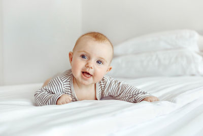 Portrait of cute boy sleeping on bed at home