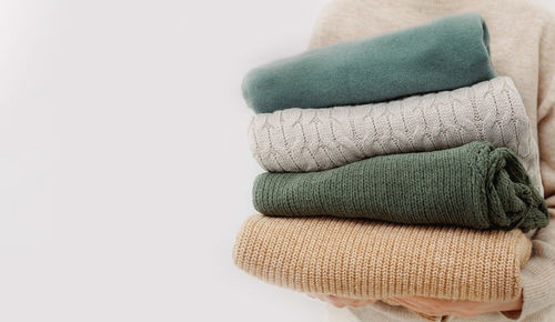 Close-up of multi colored towels against white background