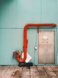 Fire hydrant against blue wall