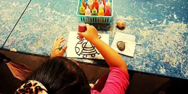 High angle view of people holding umbrella